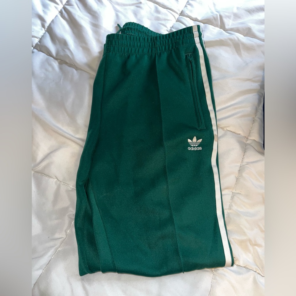 Green adidas track pants